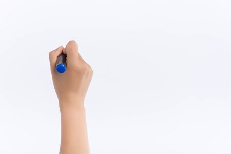 Close up of women arm writing with metallic pen. Isolated on white background.の写真素材