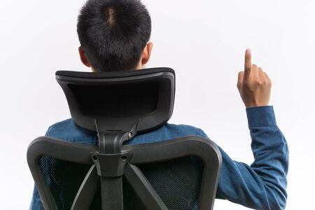 confident Young business man sitting in a chair