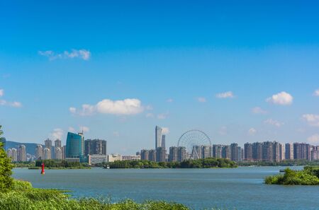 modern office building and green park in shanghai china.の写真素材