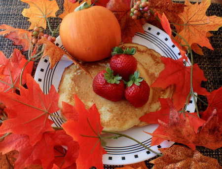 Pumpkin Pancakes and Fresh Strawberriesの写真素材