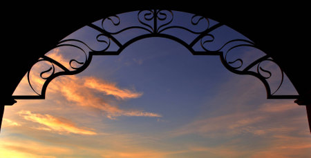 Viewing the Desert Sunrise through an Archway in Arizonaの写真素材