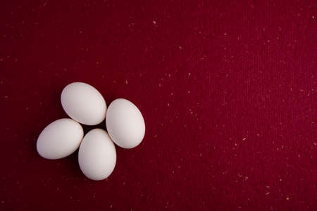 Easter eggs on top of red paperの写真素材
