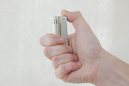 lighter in mans handの写真素材