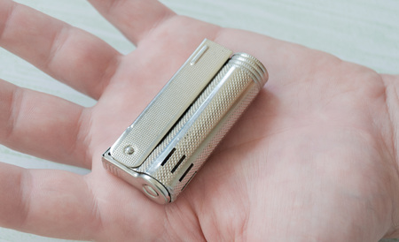 lighter in mans handの写真素材