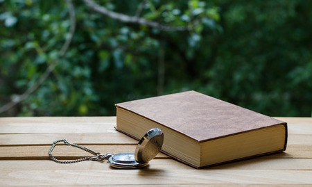 pocket watch and the bookの写真素材