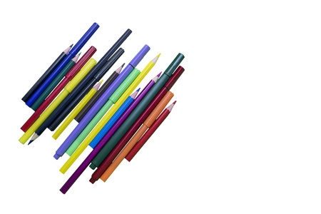 Colored pencils and markers on a white isolated backgroundの写真素材