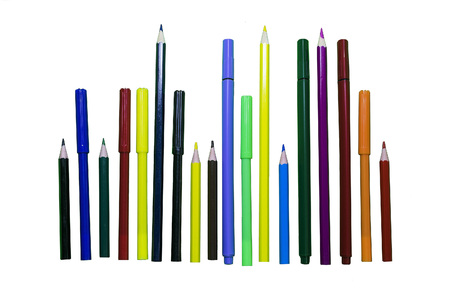 Colored pencils and markers on a white isolated backgroundの写真素材