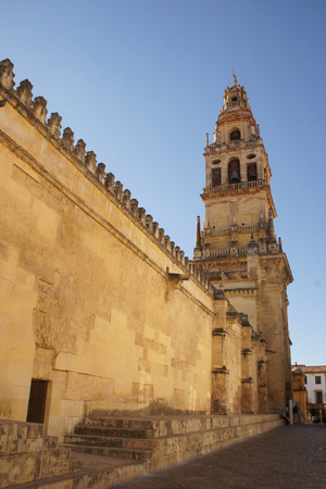 Tower and wall of the Mezquita - Cathedral in Cordoba, Spainの写真素材