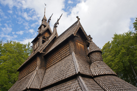 Fantoft Stavkirke - wooden church near Bergen, Norway, surrounded by trees, viking architectureの写真素材