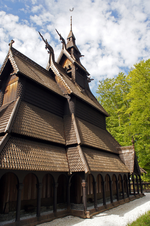 Fantoft Stavkirke - wooden church near Bergen, Norway, surrounded by trees, viking architectureの写真素材