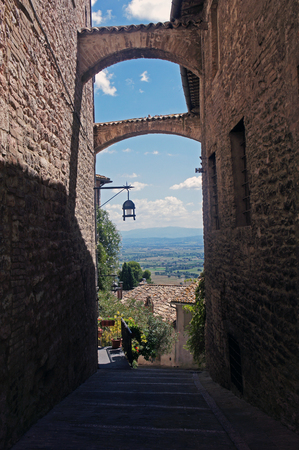 Medieval Street of Assisi and the landdcsape of Umbriaの写真素材