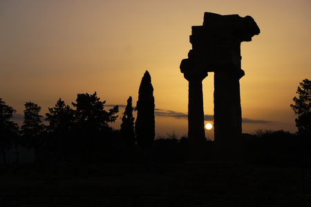 Temple of Castor and Pollux in the Valley of the Temples of Agrigento during sunset - Sicily, Italyの写真素材