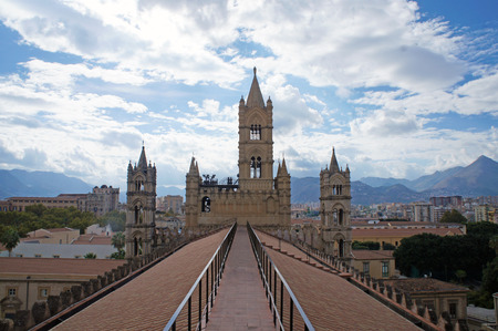 Roof and tower of the Palermo Cathedral in Sicily with mountains behind, Italyの写真素材