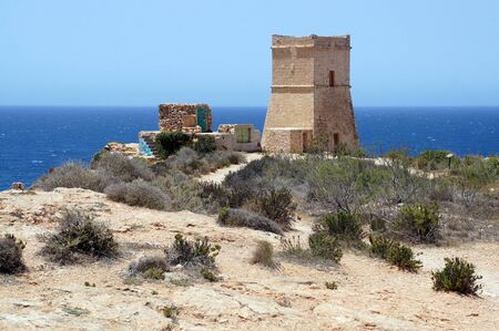 Panorama with Ghajn Tuffieha (GÄ§ajn TuffieÄ§a) Tower on the cliff next to the harbor,Golden Bay, Maltaの写真素材