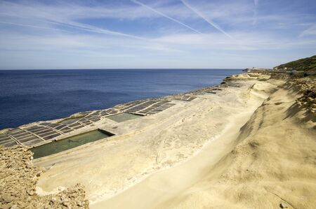 Salt Pans on the rocky beach near Marsalforn, Gozo, Maltaの写真素材