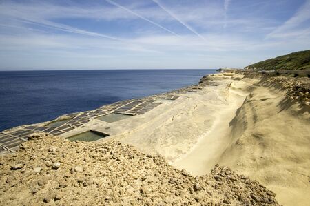 Salt Pans on the rocky beach near Marsalforn, Gozo, Maltaの写真素材