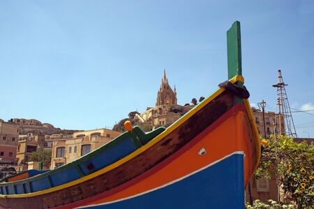 Traditionally painted colorful fishermen's boat in Mgarr, Gozo, Maltaの写真素材