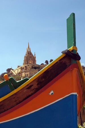 Traditionally painted colorful fishermen's boat in Mgarr, Gozo, Maltaの写真素材