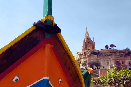 Traditionally painted colorful fishermen's boat in Mgarr, Gozo, Maltaの写真素材