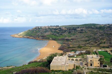 on red sandy beach in Ramla Bay, Gozo, Maltaの写真素材