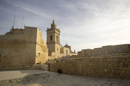 Side view of the Cathedral of the Assumption in the Cittadella of Victoria in Gozo, Maltaの写真素材