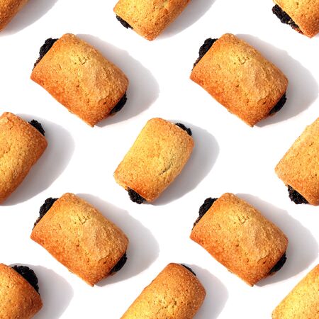 Poppy-seed cookies are on the white table. Seamless pattern. Isolated white backgroundの写真素材