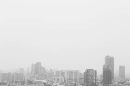 black and white of city in the fog