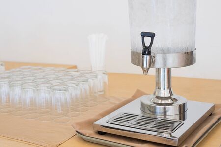 Drinking Water dispenser with Ice and glass Cup on the Table for meeting, Seminar or conference room as Catering service conceptの写真素材