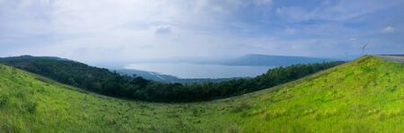 Beautiful panoramic view over lake and mountains background