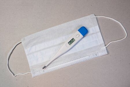 Electronic thermometer with a medical mask