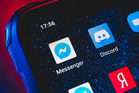 Facebook Messenger app icon on the screen smartphone. Online internet social media network.のeditorial素材