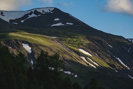 An impressive mountain range at sunset in the Ulagansky District of the Altai republic, Russia
