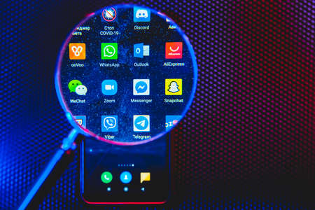 Lots of apps for connecting people and working from home on the smartphone screen. Including Zoom,...