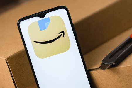 Kazan, Russia - May 14, 2021: Amazon is an American multinational technology company, which focuses on e-commerce, cloud computing, digital streaming, and artificial intelligence.のeditorial素材