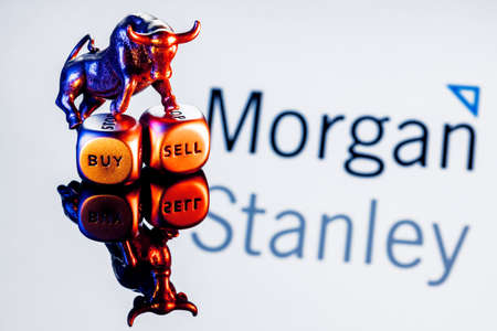 Kazan, Russia - Dec 09, 2021: Metal bull stands on buy-sell dices on background of Morgan Stanley bank logoのeditorial素材