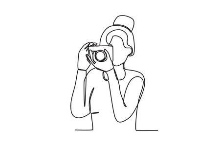 A woman taking pictures. World photography day one-line drawingのイラスト素材