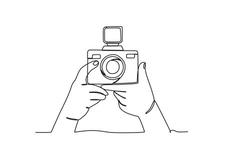 A hand prepares to take pictures. World photography day one-line drawingのイラスト素材