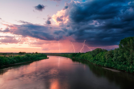 Evening storm over watershed and dramatic sky and cloudsの写真素材
