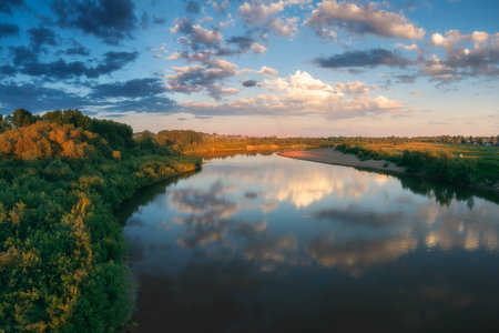 Evening scene on river. Sunset color. forestの写真素材
