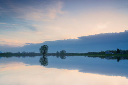 beautiful sky reflected in lake. russian villageの写真素材
