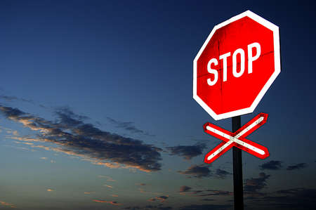 Bright Red Stop Sign at Late Eveningの写真素材