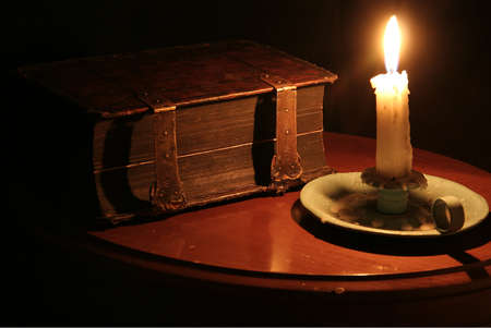 Old Book by Candle Light