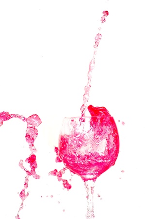 Pouring red wine into a wine glassの写真素材