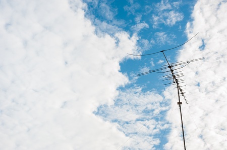 an antenna with blue sky and cloudの写真素材