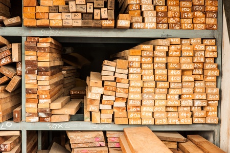 Pile of Wood Stored in stock on shelfの写真素材