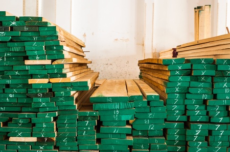 Pile of Wood Stored in stock painted green and marked sizeの写真素材