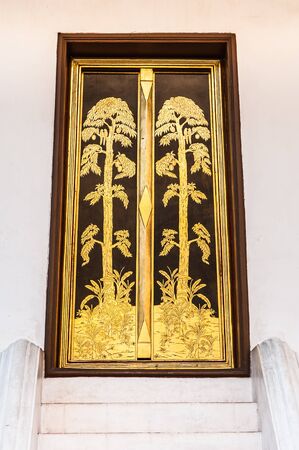 Wooden door with gold textureの写真素材