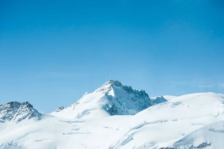 Snow Mountain Landscape with Blue Sky from Jungfrau Region の写真素材