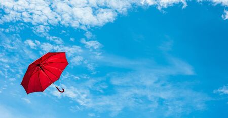 Flying Red Umbrella with Blue sky