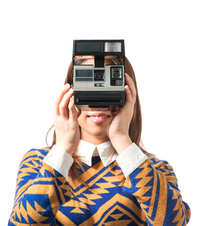 Girl using camera on isolated の写真素材